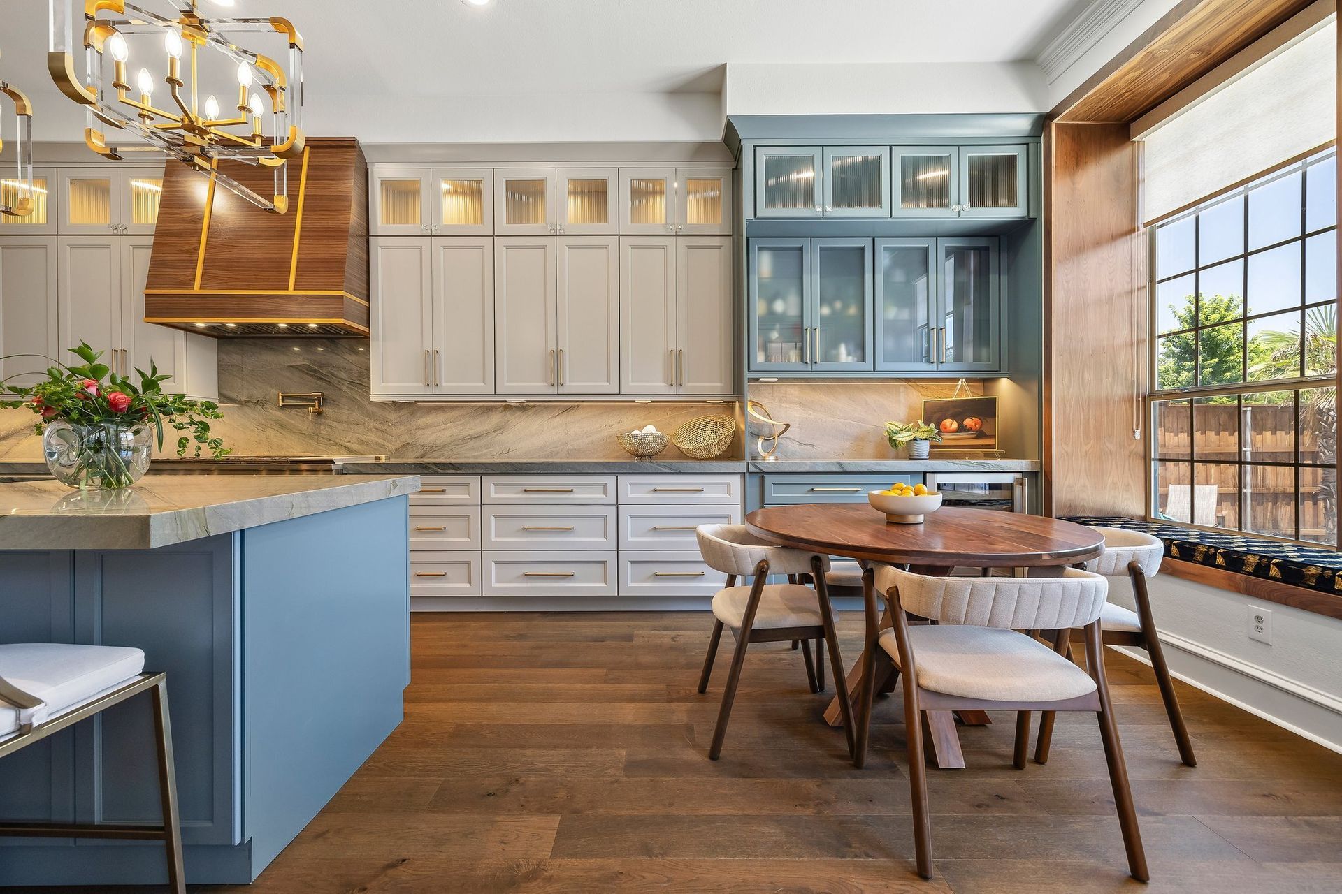 Painted custom kitchen cabinets from the Twin River Cabinets Casa Collection with contrasting island and custom color finish.