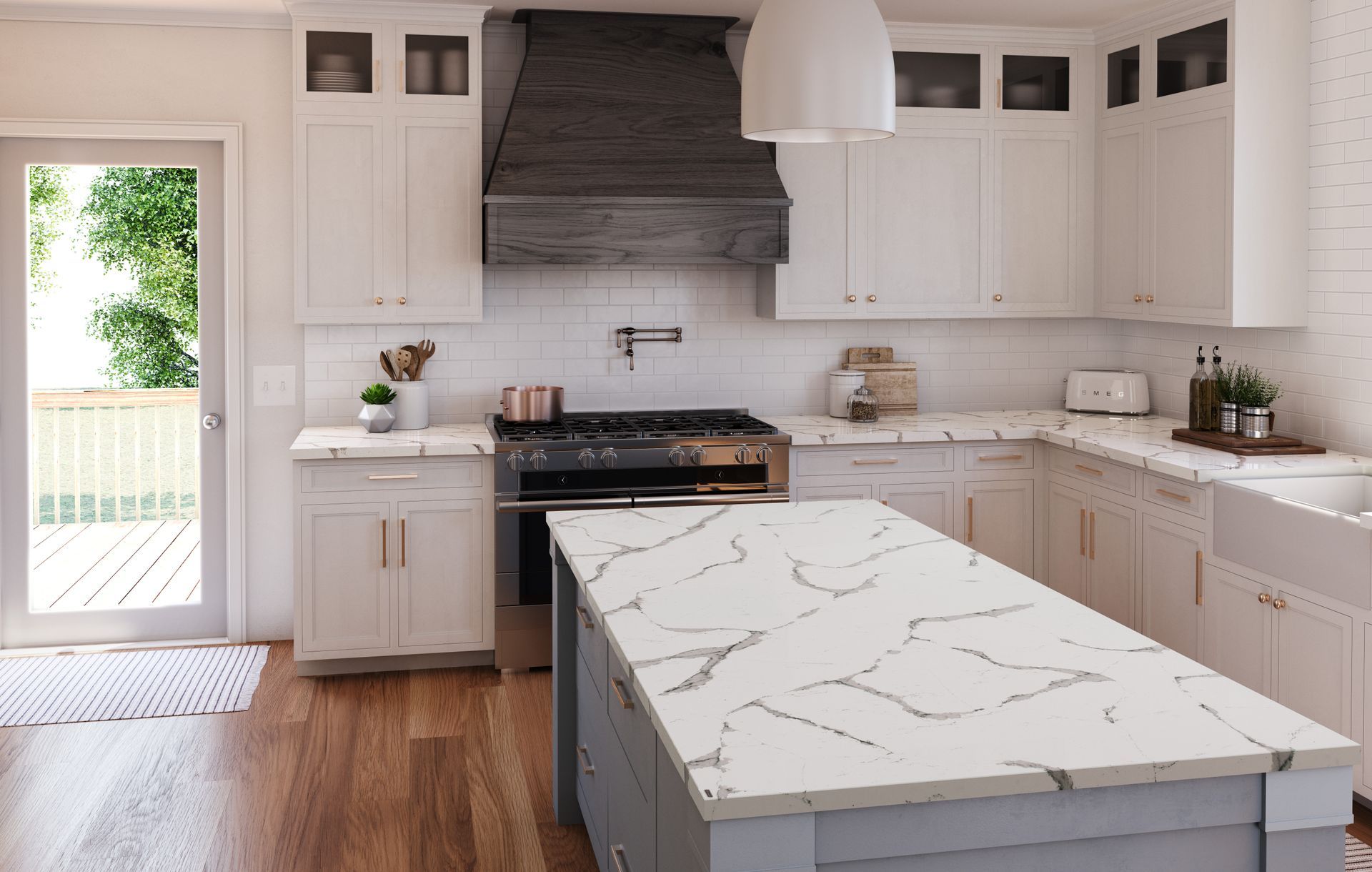 White kitchen with a Cambria quartz island and dark wood range hood