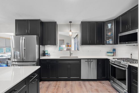 Painted Casa Collection cabinetry by Twin River Cabinets featuring smooth paint-grade doors in a timeless kitchen design.