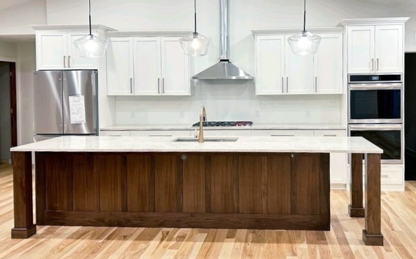 White Shaker kitchen cabinetry with a Walnut island from the Signature Collection