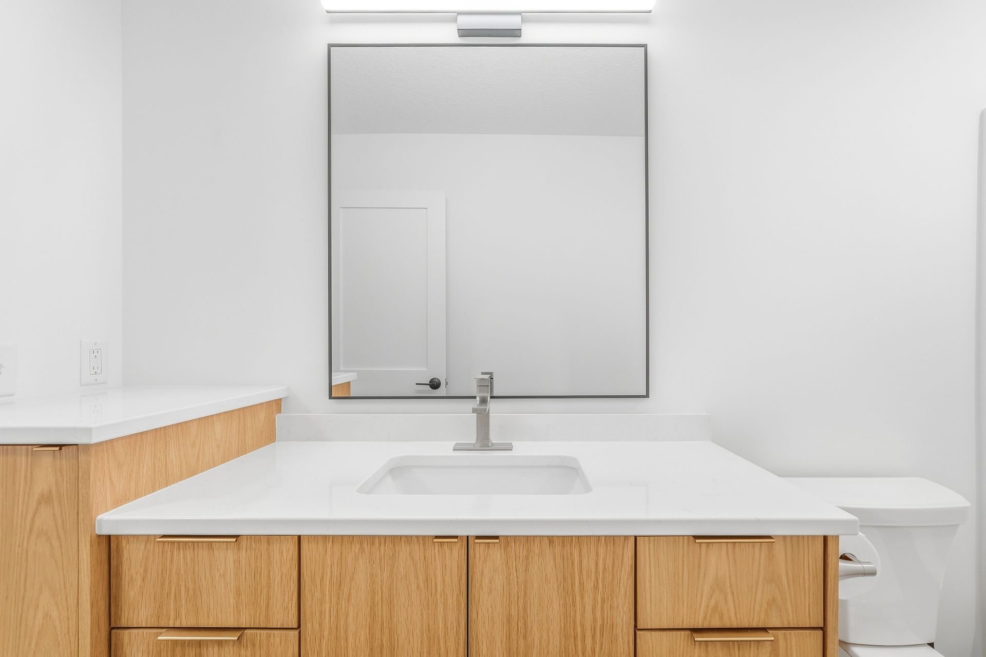 White oak bathroom vanity with custom drawer storage in Centerville, MN
