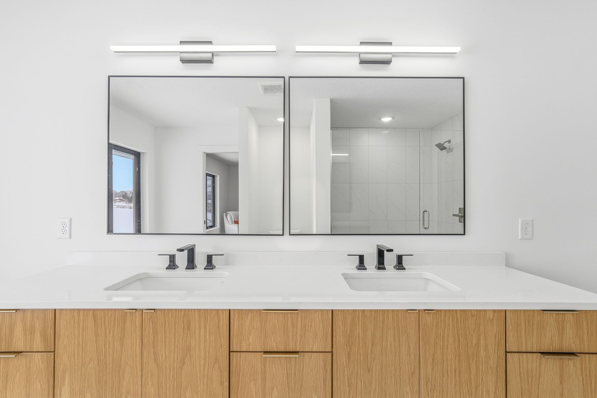White oak double vanity with flat-panel custom cabinetry in Centerville, MN
4.