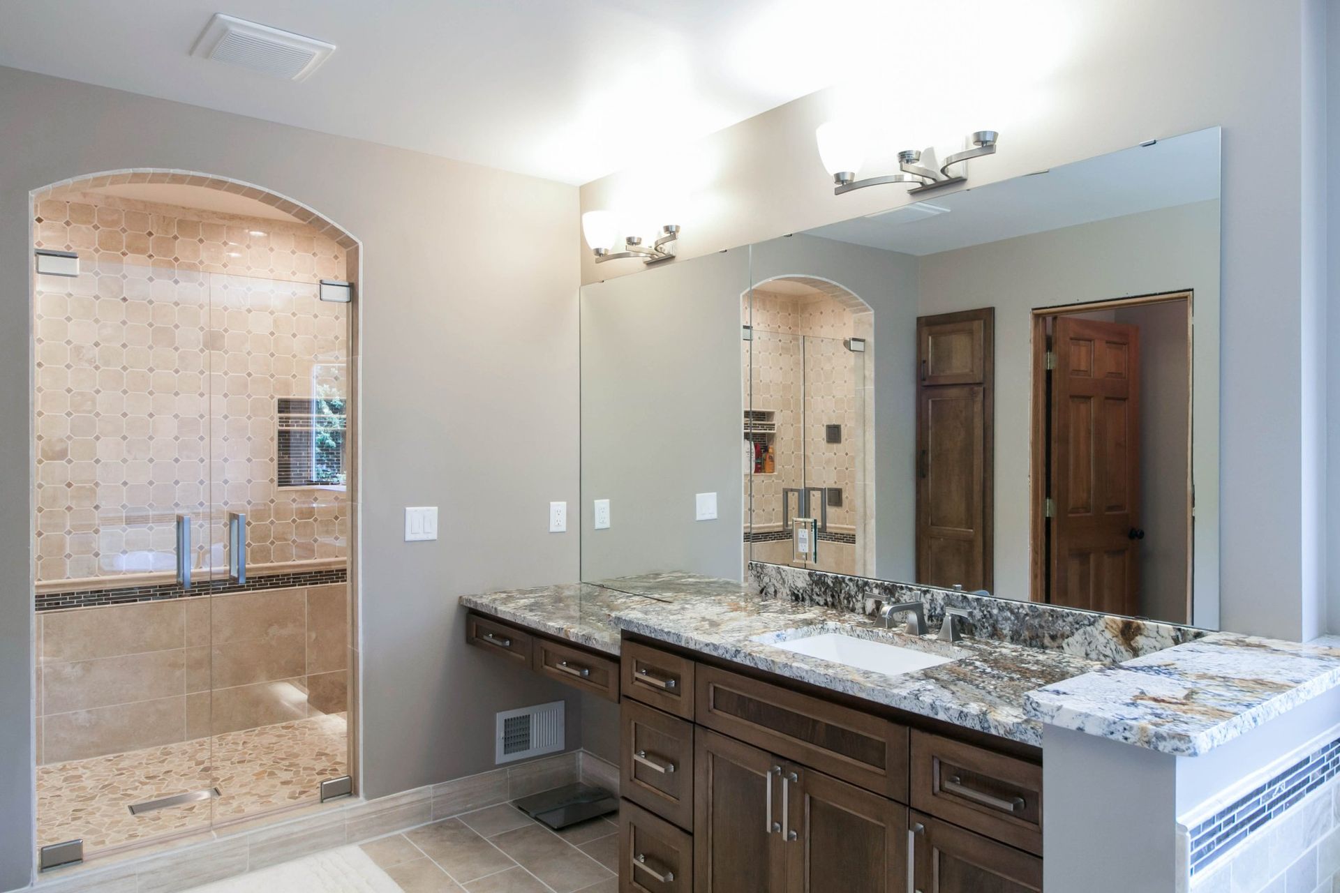Custom maple bathroom vanity with double sinks and drawer storage
