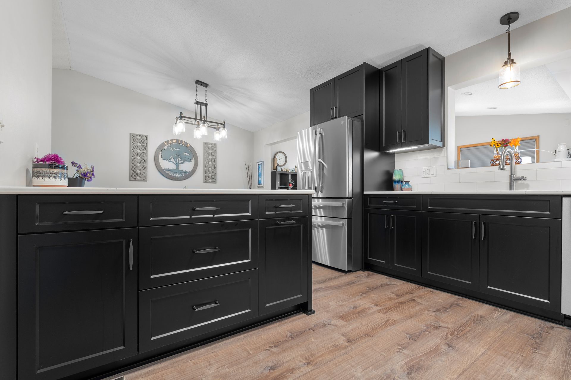 Black Casa Collection kitchen island with deep storage drawers and black hardware in Lino Lakes, Minnesota.