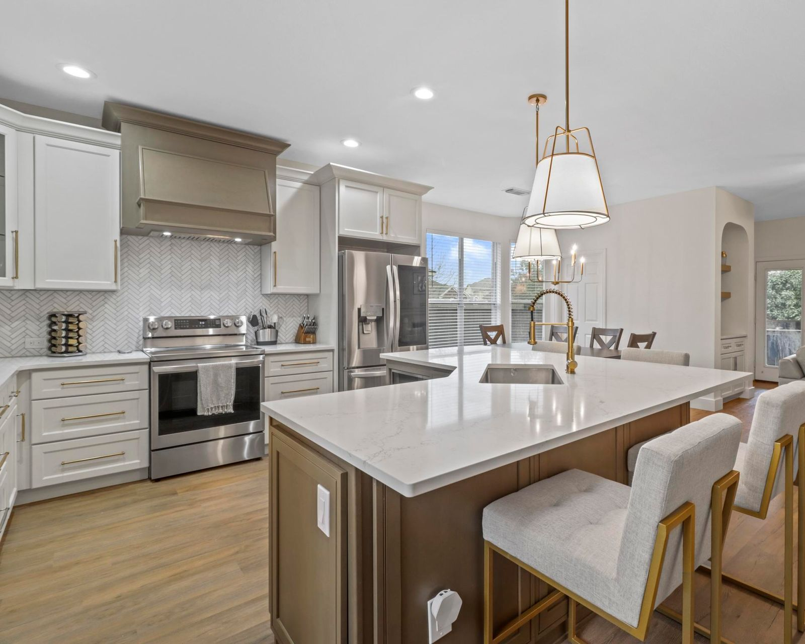 Semi-custom Summit kitchen cabinetry with white cabinets and contrasting island