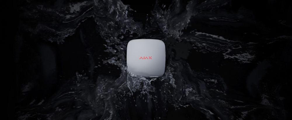 A square, white AMX device centred against a backdrop of swirling black and grey liquid patterns— Cussler NQ in Cannonvale, QLD