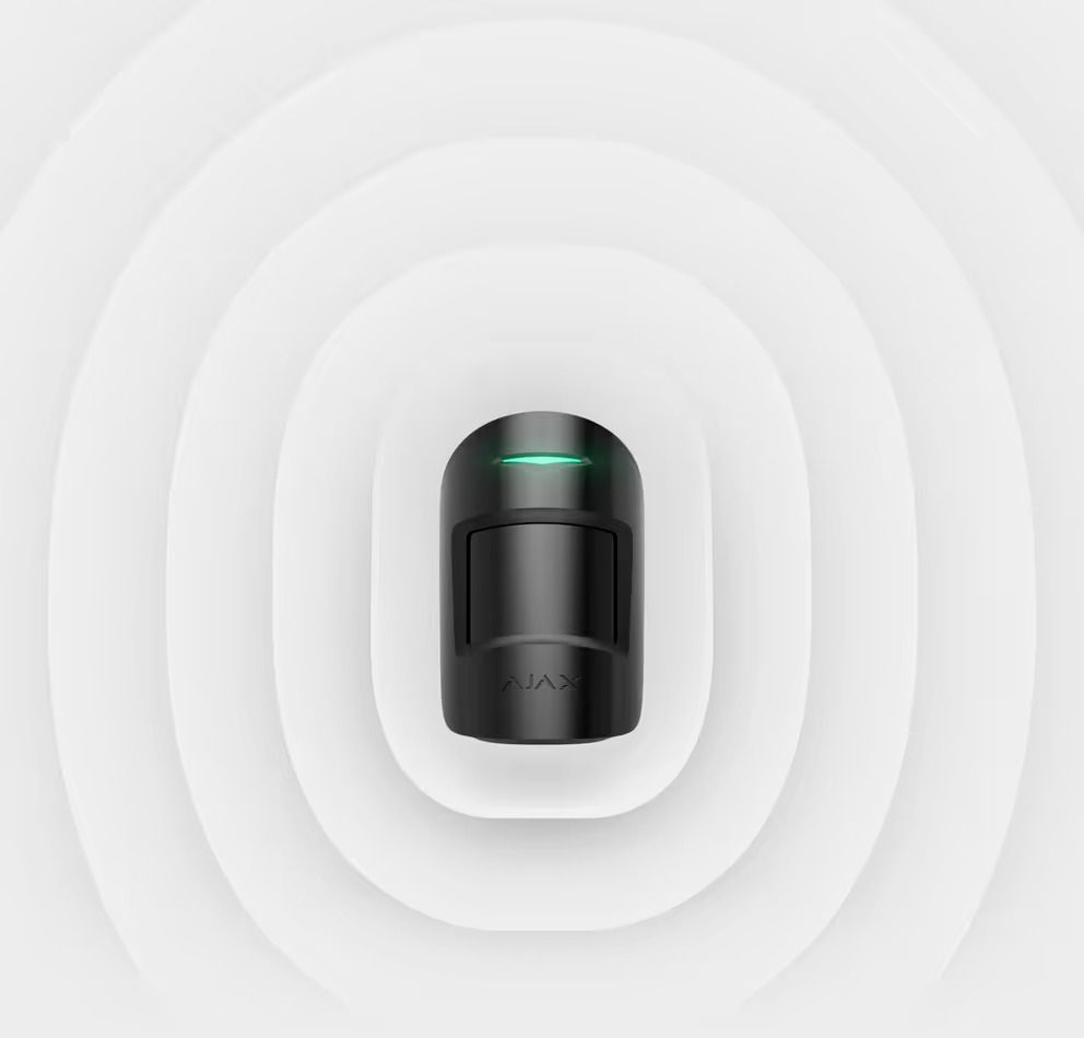 Black Motion Sensor With a Green Light, Surrounded by Concentric White Ovals — Cussler NQ in Cannonvale, QLD