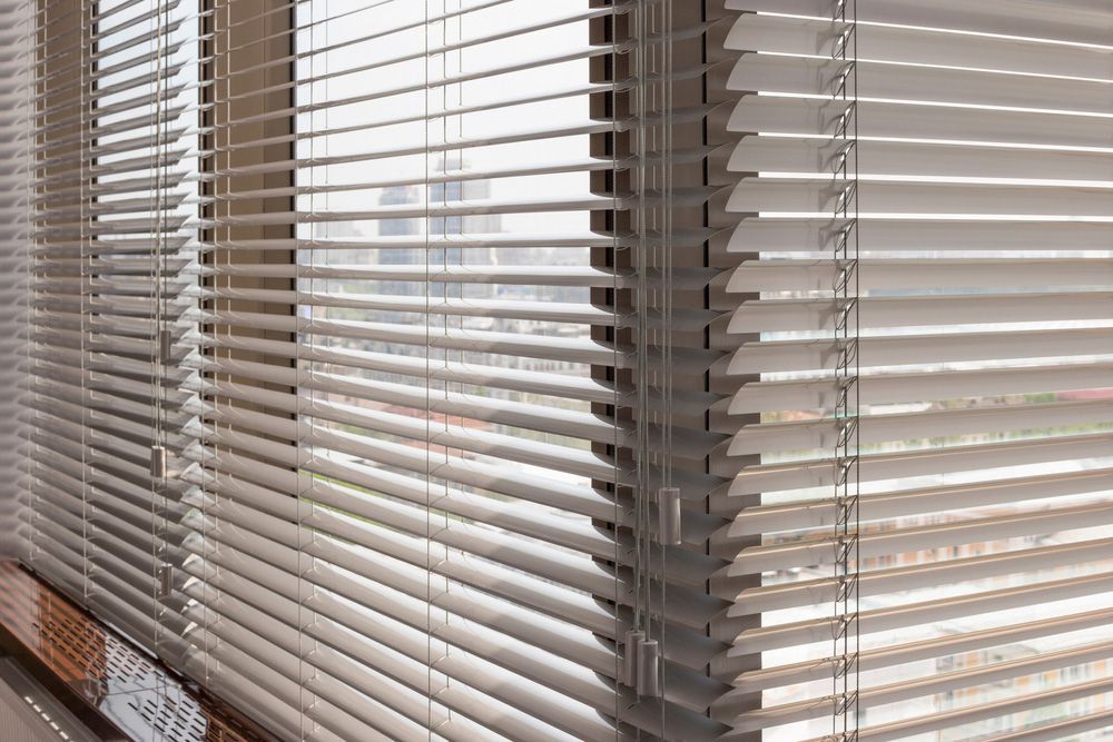 Aluminium Blinds Adorning Office Windows — Southern Blinds & Awnings In Bundanoon NSW