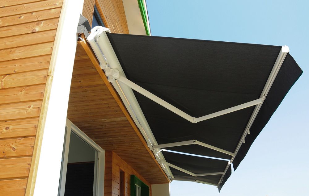 Modern Wooden House with Stylish Sunshade Awning — Southern Blinds & Awnings In Moss Vale NSW