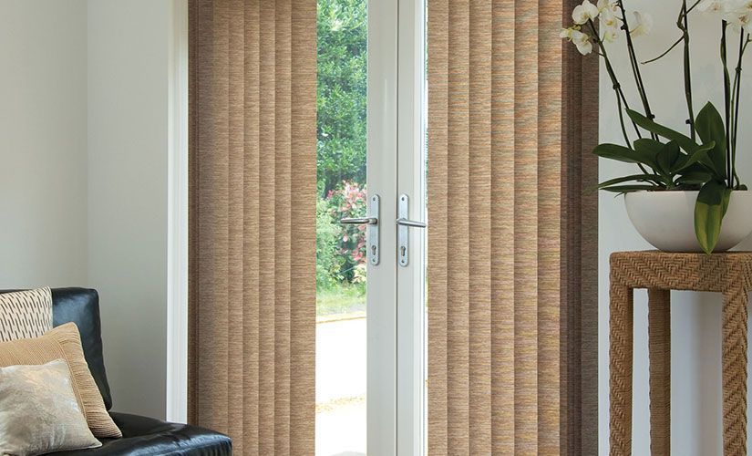 A Door With Blinds And A Plant In Front Of It — Southern Blinds & Awnings In Balaclava NSW