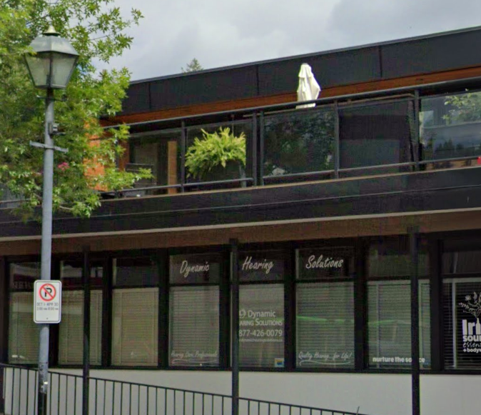 Exterior view of a commercial building with signs for
