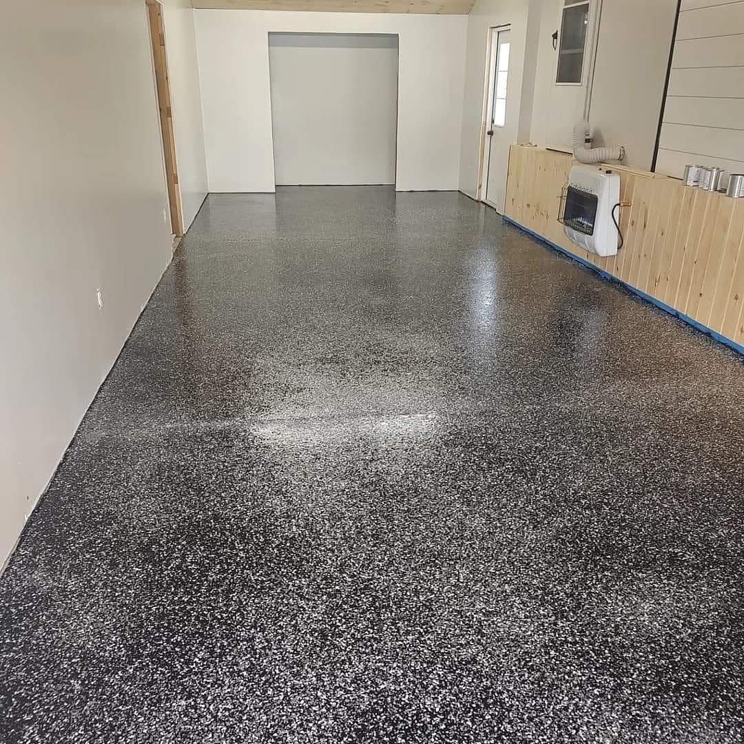 A large room with a black and white floor and white walls.