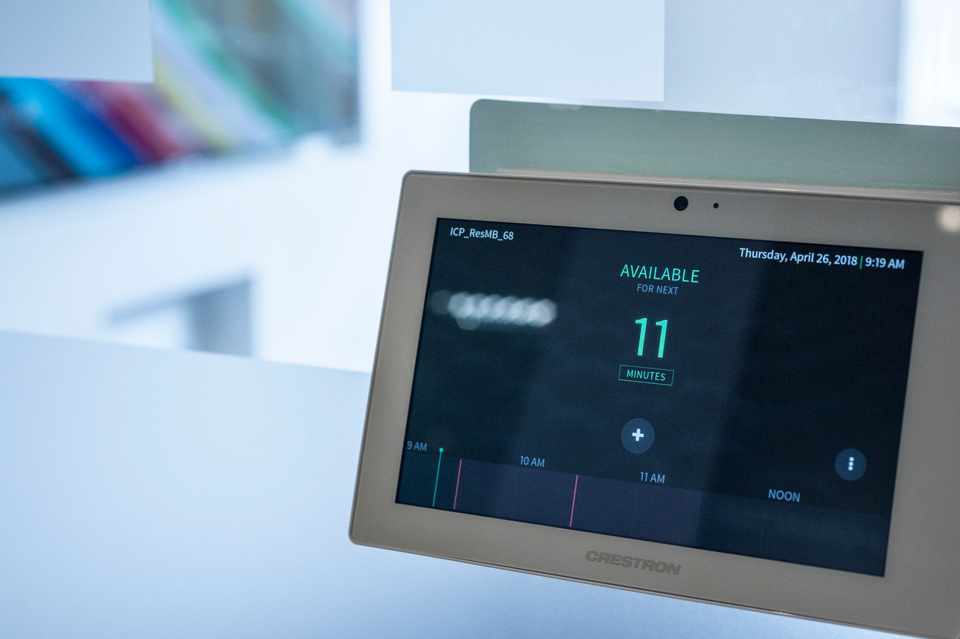 Close-up of a digital thermostat display showing 11°C on a wall-mounted control panel.