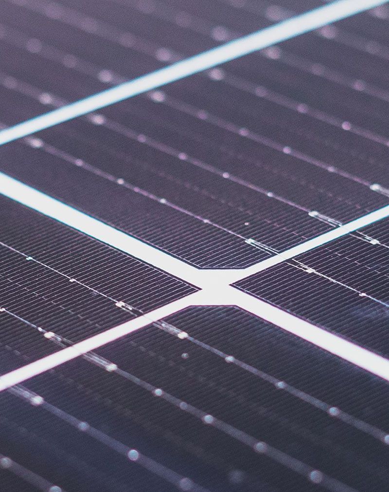 Close-up of dark solar panels with white grid lines