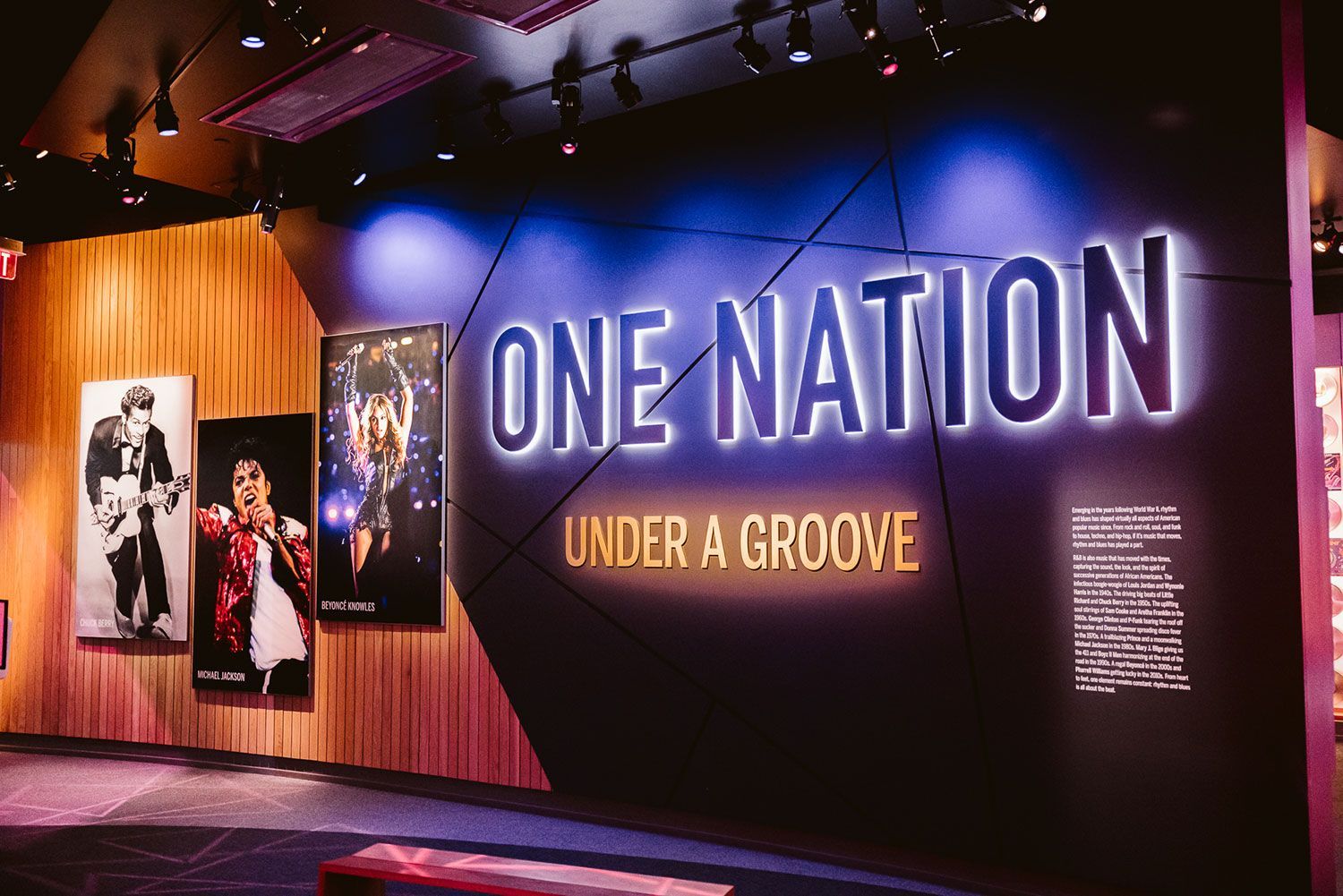 A sign that says one nation under a groove on it
