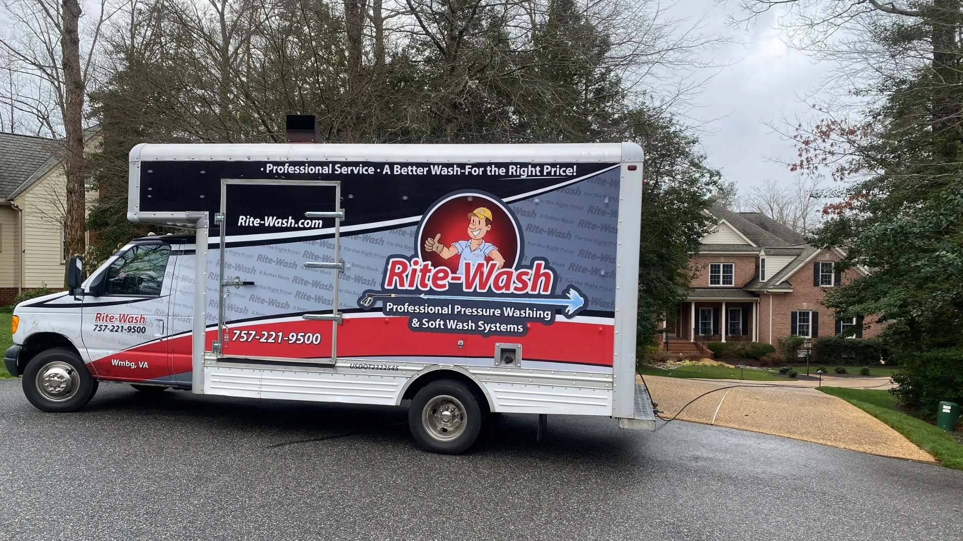 Rite-Wash truck parked on a residential street with a repaired concrete driveway in the background