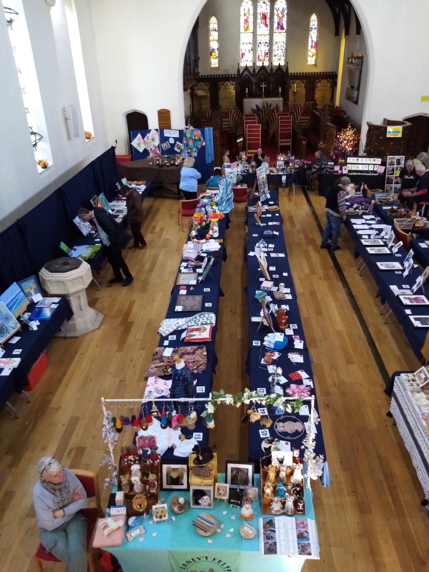 An aerial view of a church filled with tables and people