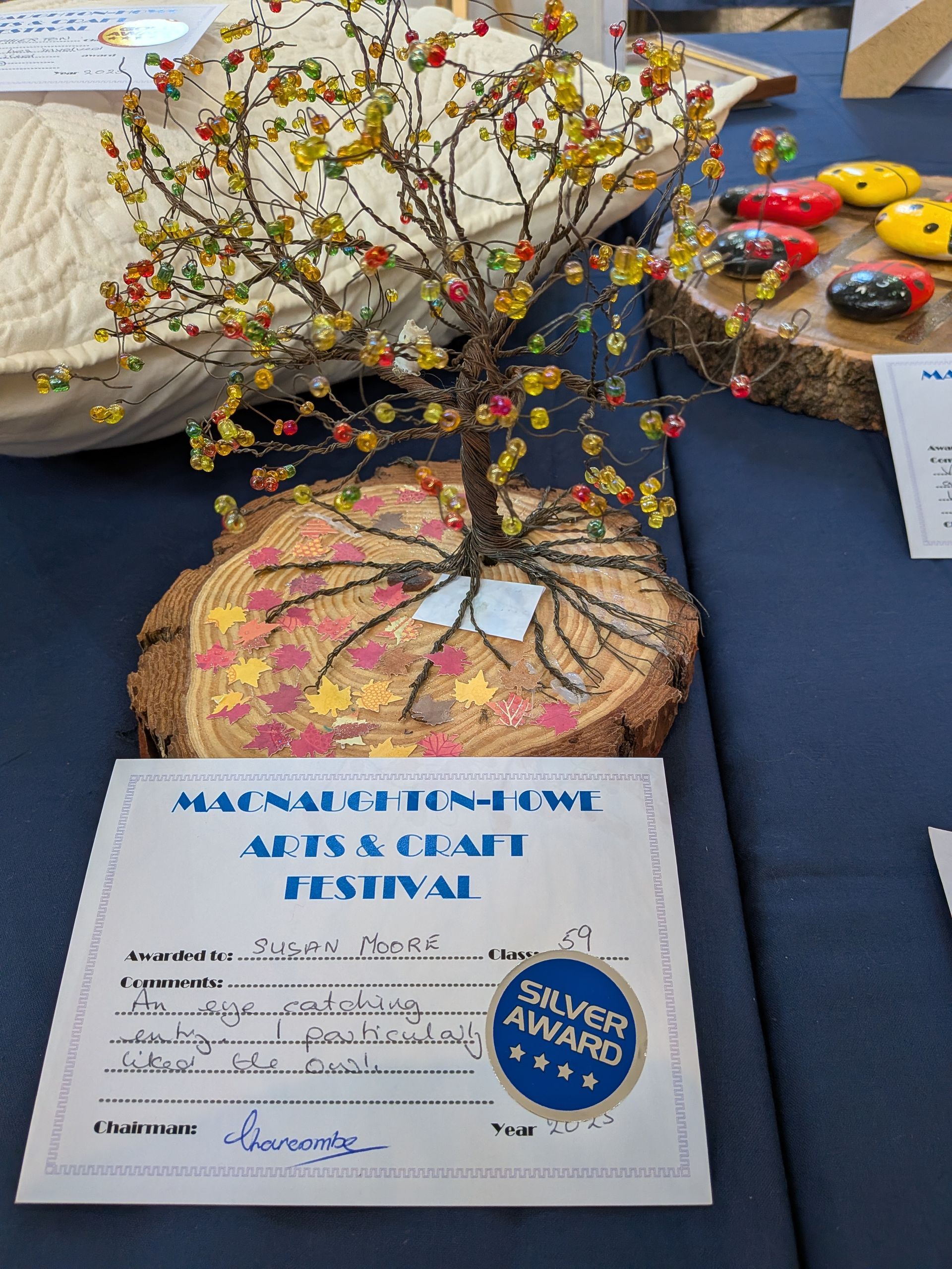 Beaded tree sculpture on wood base, silver award certificate at the Macnaughton Owl Arts & Craft Festival.