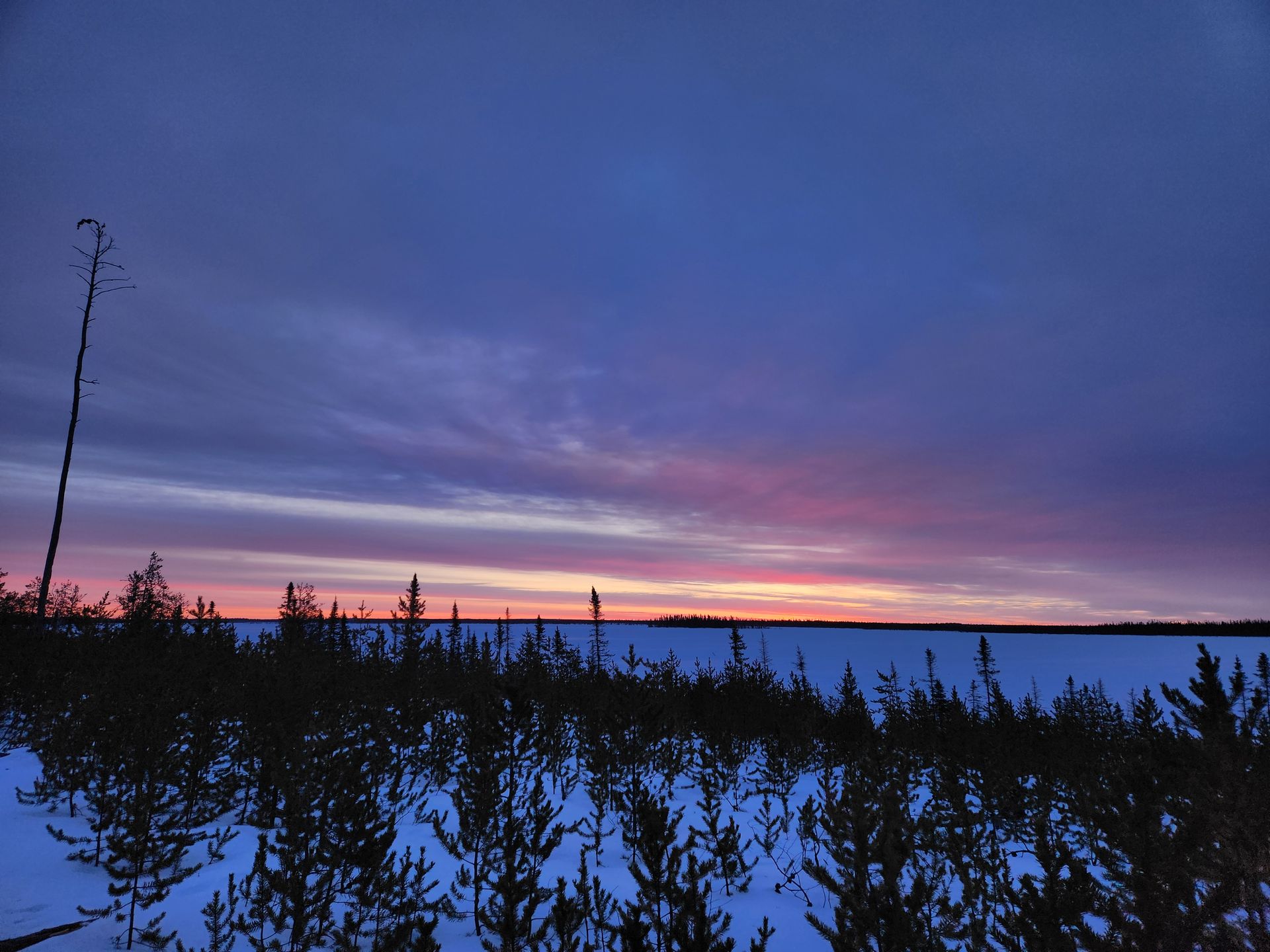 Sunset over frozen terrain near Cosa Resources exploration, representing uranium mines in Canada and Saskatchewan.
