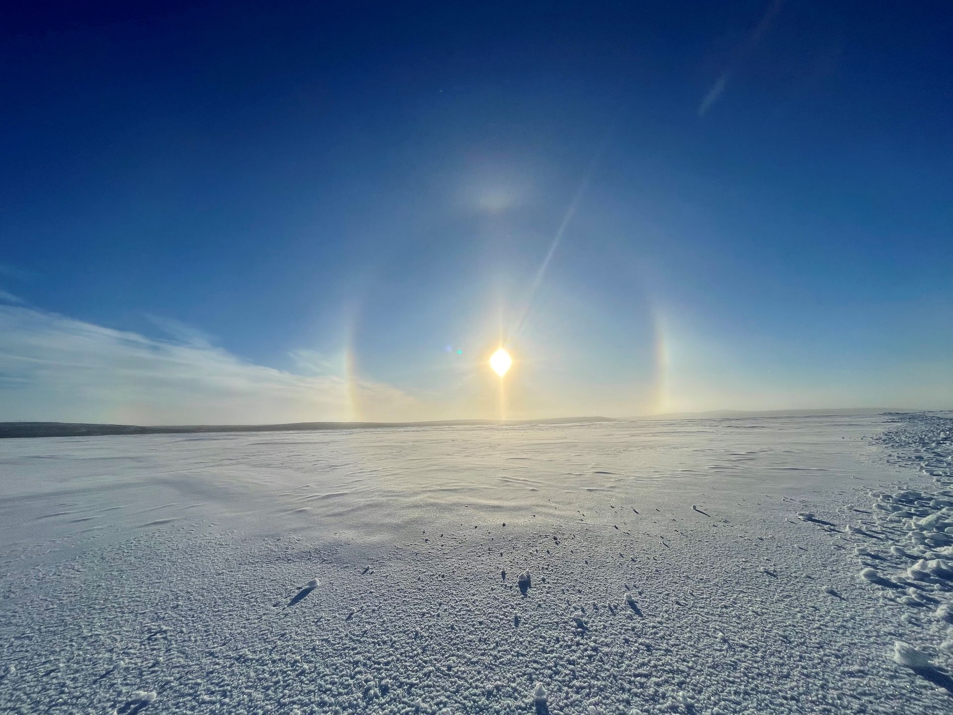 Bright sun halo above frozen landscape near Cosa Resources Canadian uranium exploration in Saskatchewan.