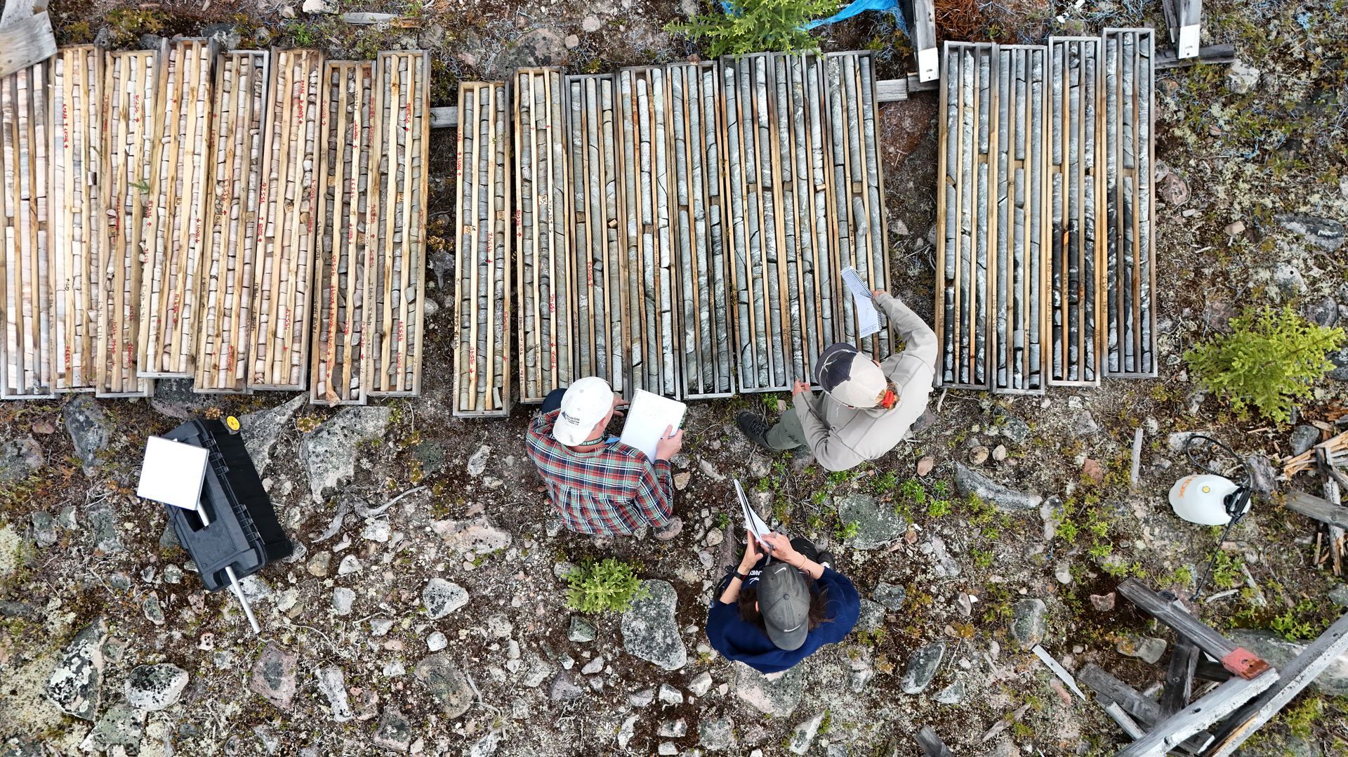 Aerial view of geologists inspecting drill core for Cosa Resources Saskatchewan uranium mining in Canada.