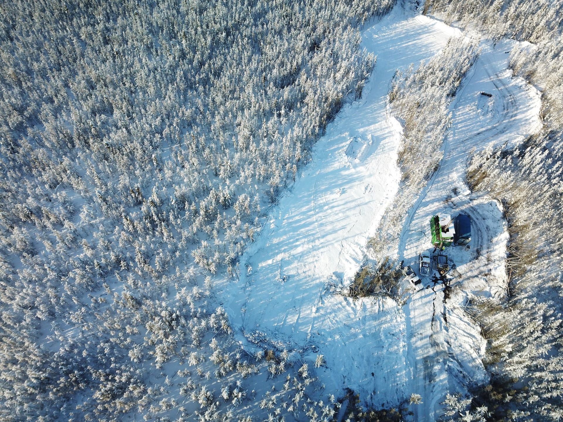 Aerial view of a cleared winter drill pad and access trail for Cosa Resources Saskatchewan uranium mining.