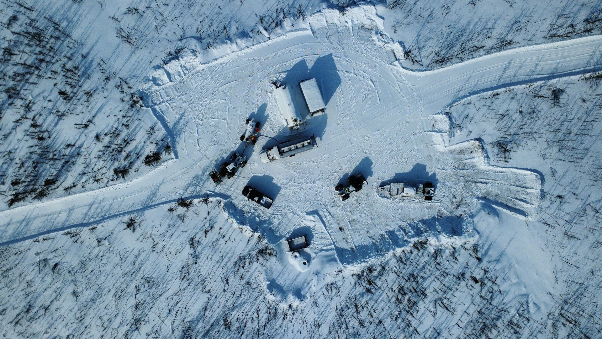 Aerial view of Cosa Resources exploration camp along a snow-covered road in Saskatchewan Canadian uranium region.