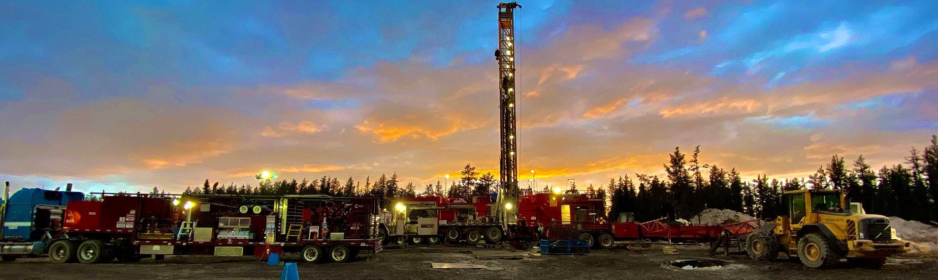 Illuminated drill rig operating near uranium mines in Canada for Cosa Resources Saskatchewan uranium mining.