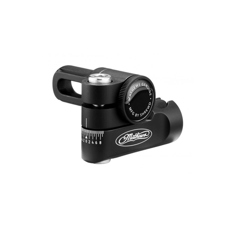 Black metal optical sight with adjustment knob and mounting rail on white background