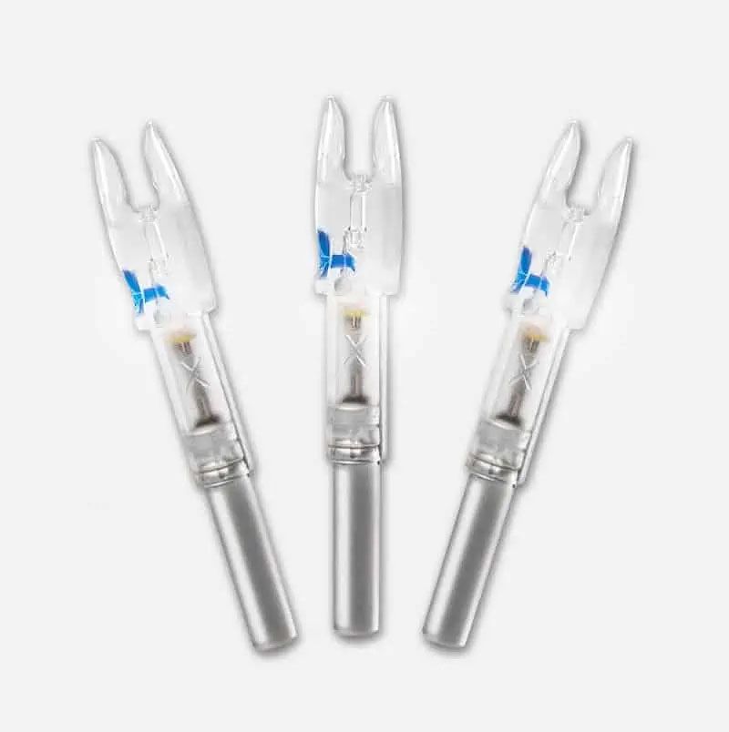 Three clear plastic medical connector tips with silver ends, arranged on a white background
