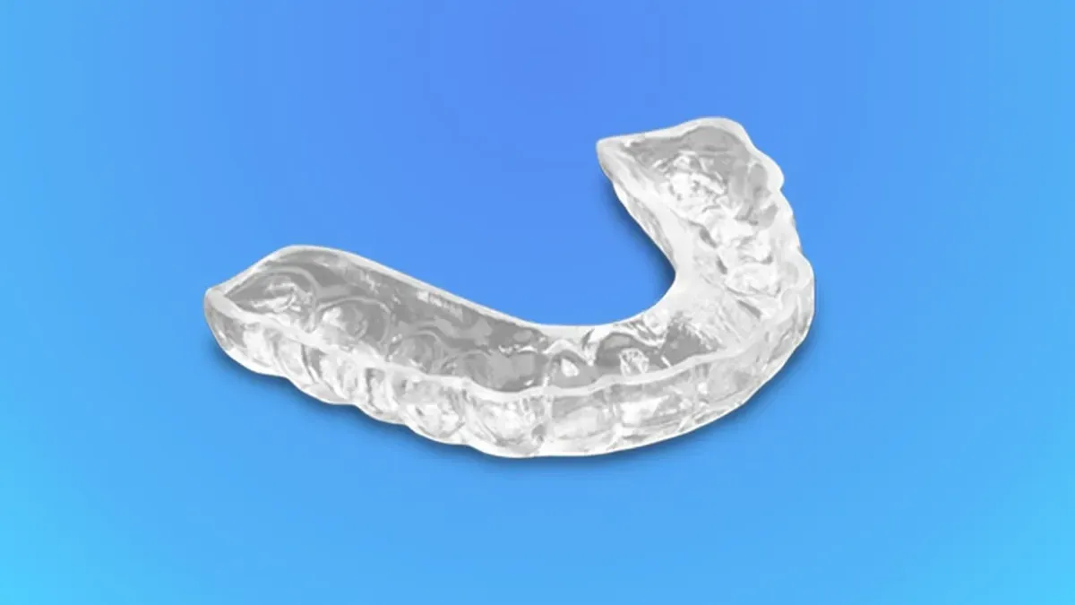 Patient receiving a night guard for teeth grinding relief Patient receiving a night guard for teeth grinding relief