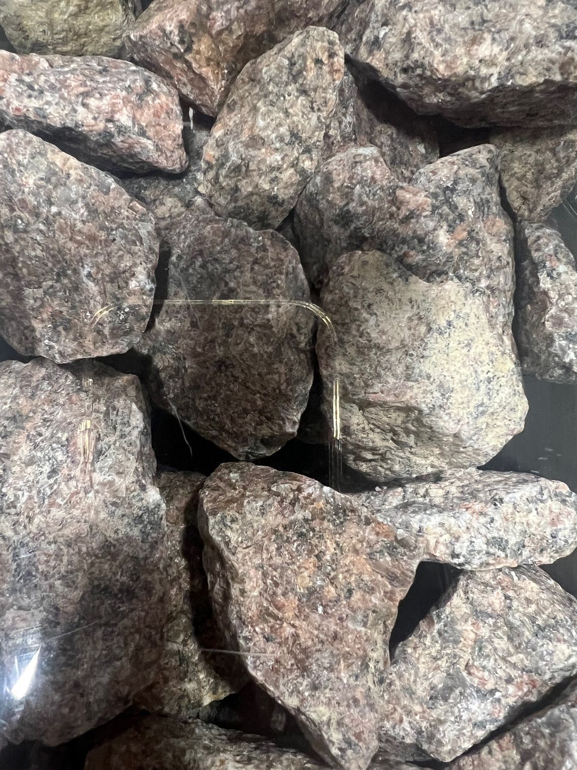 Stockman Stoneworks Is Your Go-to for Bulk Mo-Red Granite Rock in Missouri Landscapes.