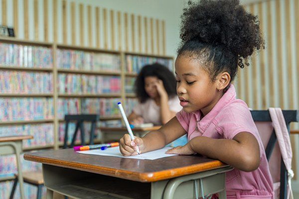 African American girl writing