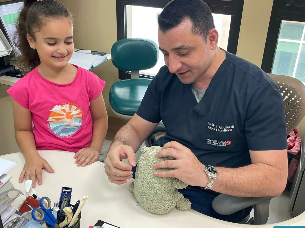 Dr. Loiy Alkhatib with patient