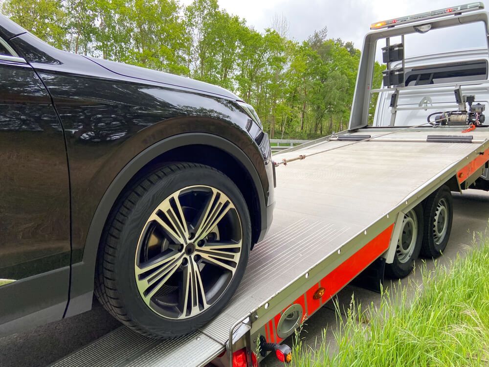 SUV Is Pulled Onto A Tow Truck — Big Tim's Towing in Cessnock, NSW 