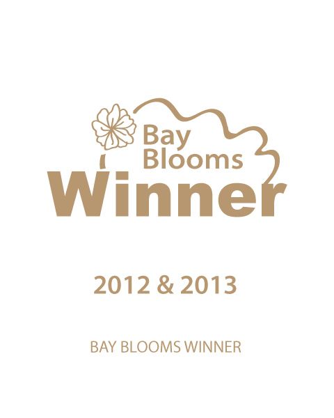 A logo that says bay blooms winner 2012 & 2013
