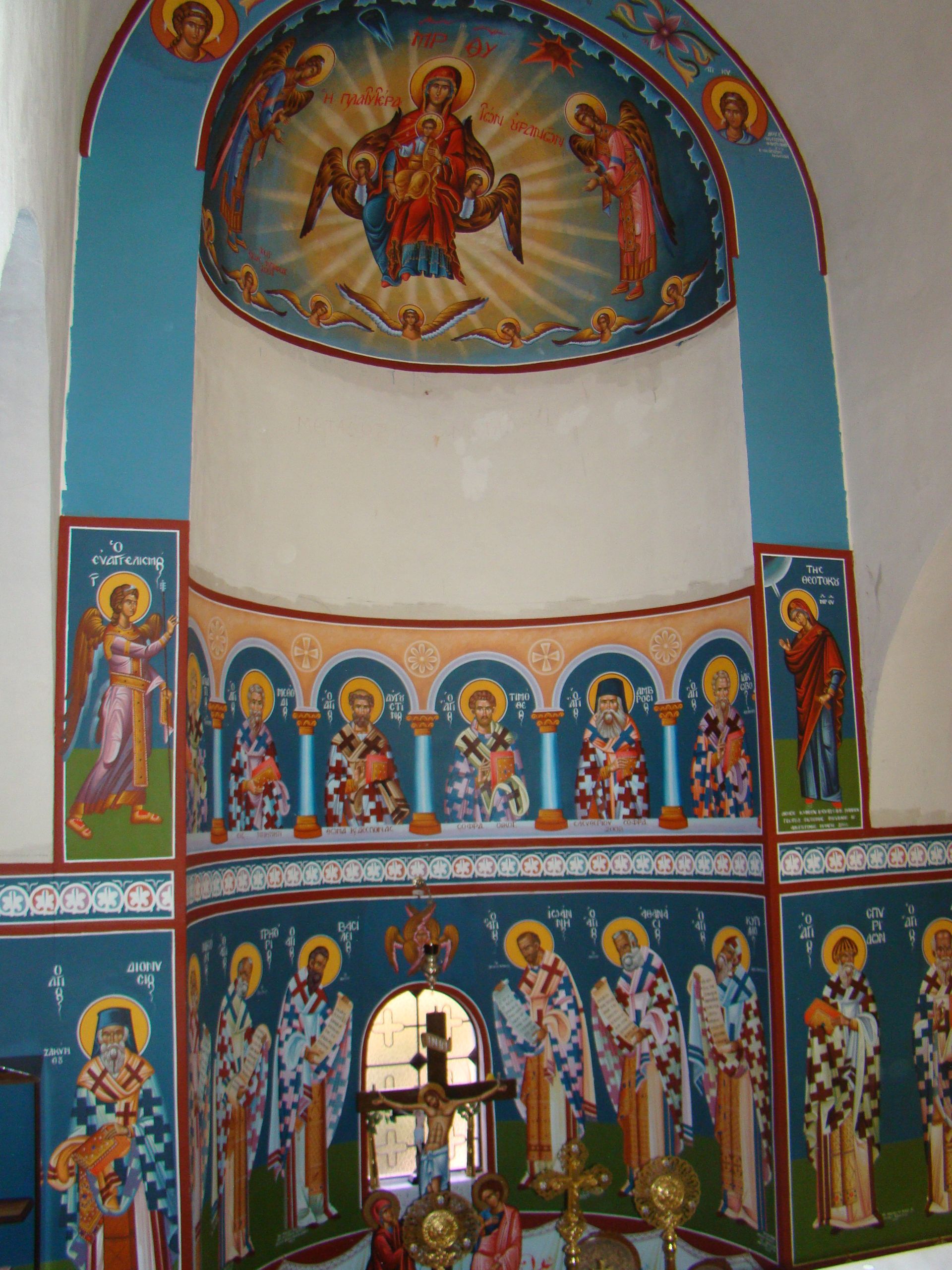 A painting of jesus surrounded by angels in a church