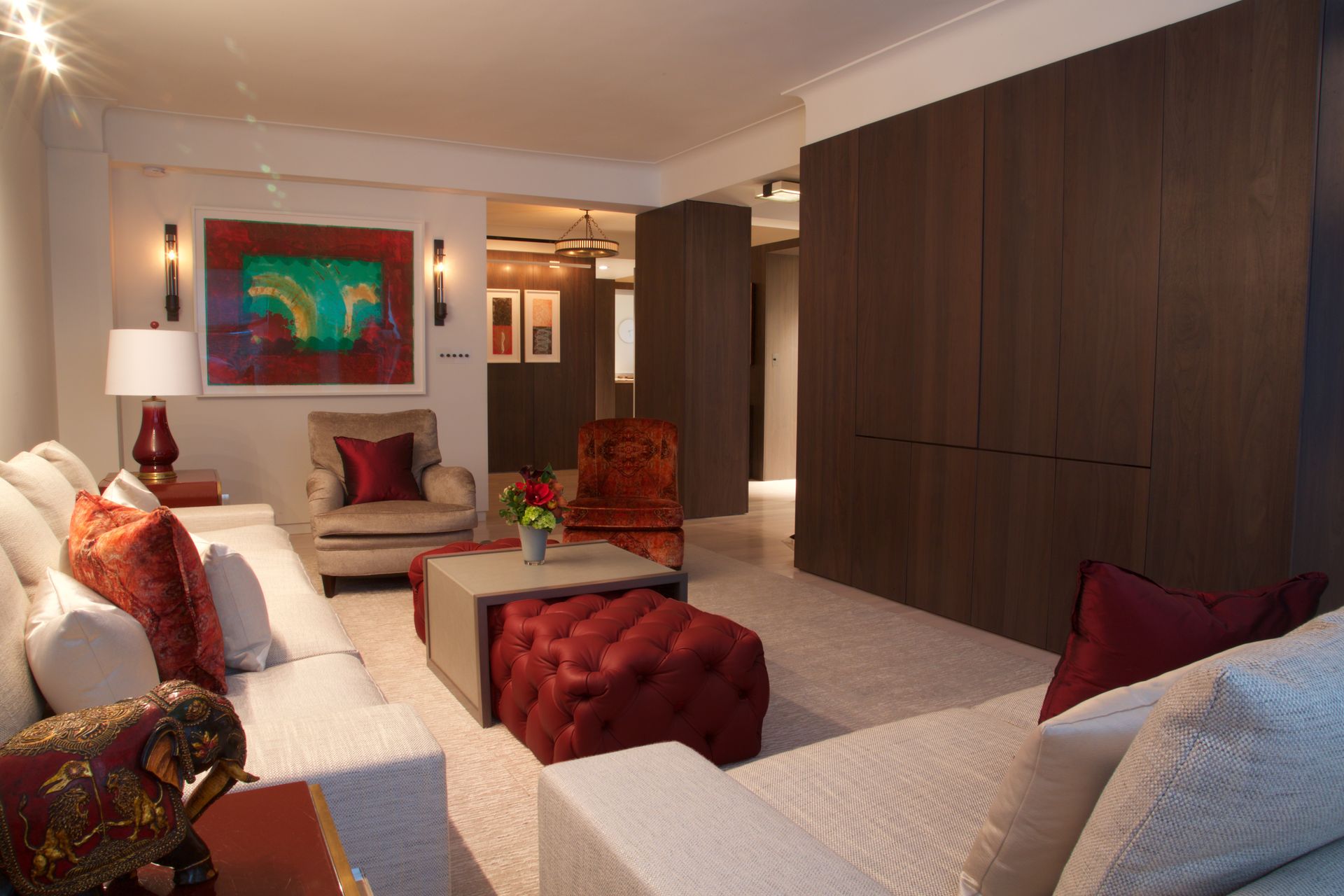 A living room filled with furniture and a painting on the wall