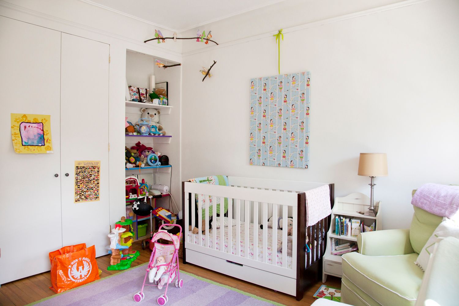 A baby 's room with a crib and a chair