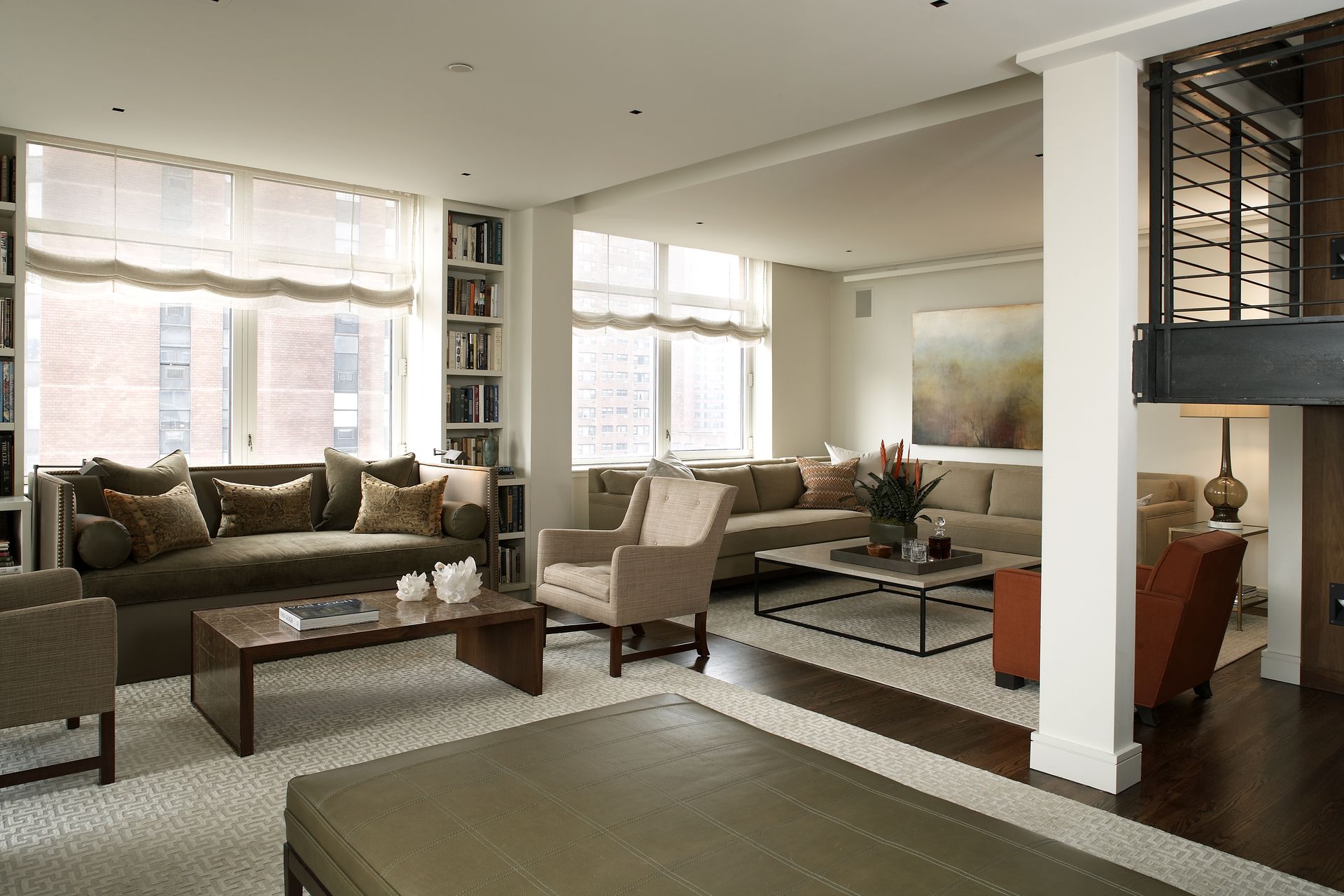 A living room with a couch and chairs and a coffee table
