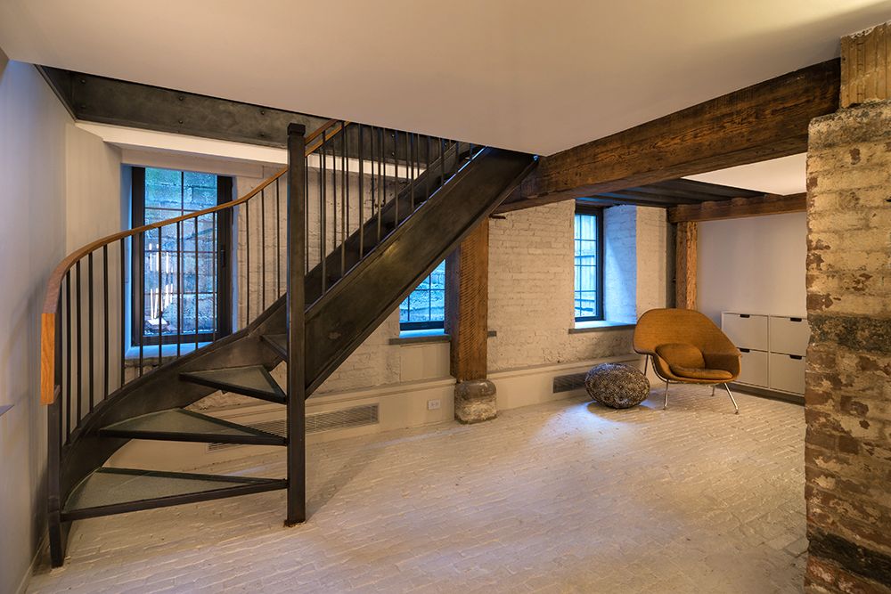 There is a spiral staircase in the middle of the room.