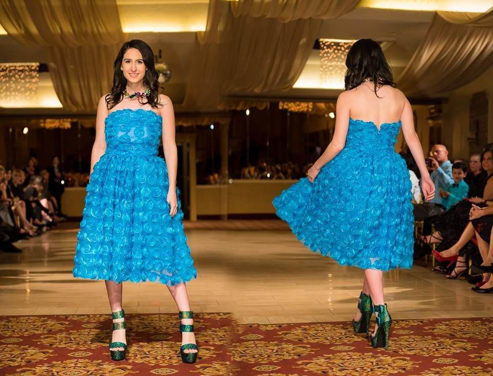 Woman modeling a bright blue dress 