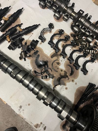 A bunch of metal parts are sitting on a table