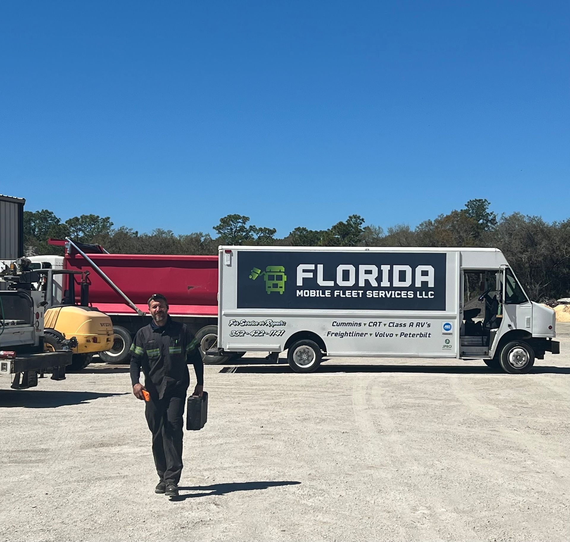 A man walking in front of a florida truck