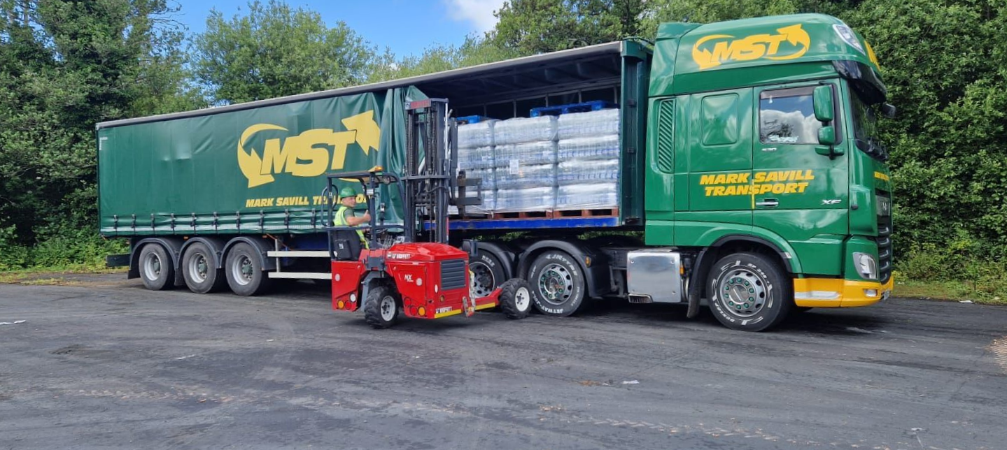 Moffett unloading truck