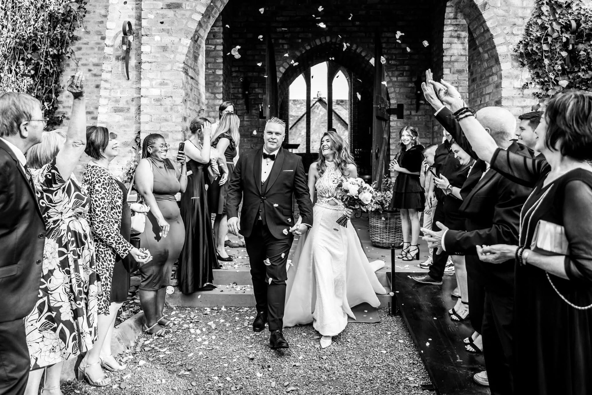 A couple is celebrated after the wedding ceremony at Riverside Castle.