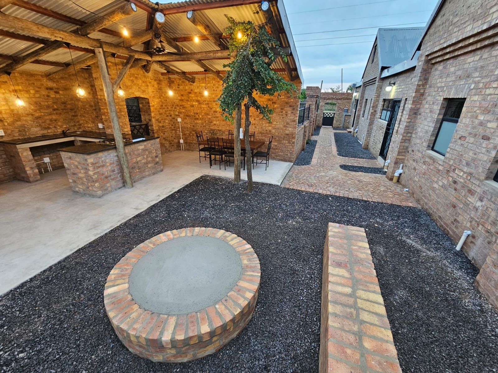 The fire pit in the courtyard of the sleek and modern new cottages at Riverside Castle.