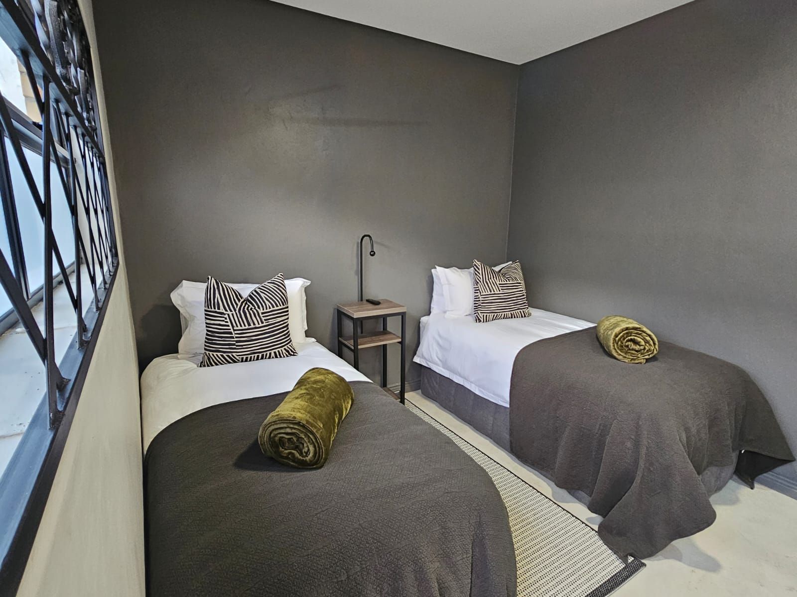 One of the standard rooms in the sleek and modern new cottages at Riverside Castle in Pretoria.