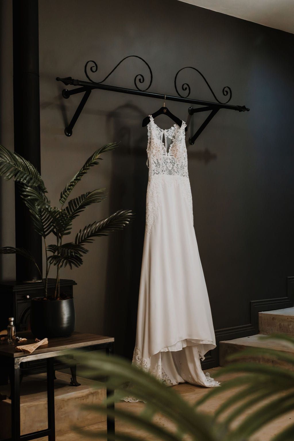 A wedding dress is hanging on a hanger in the Honeymoon suite at Riverside Castle, Pretoria's main wedding venue..