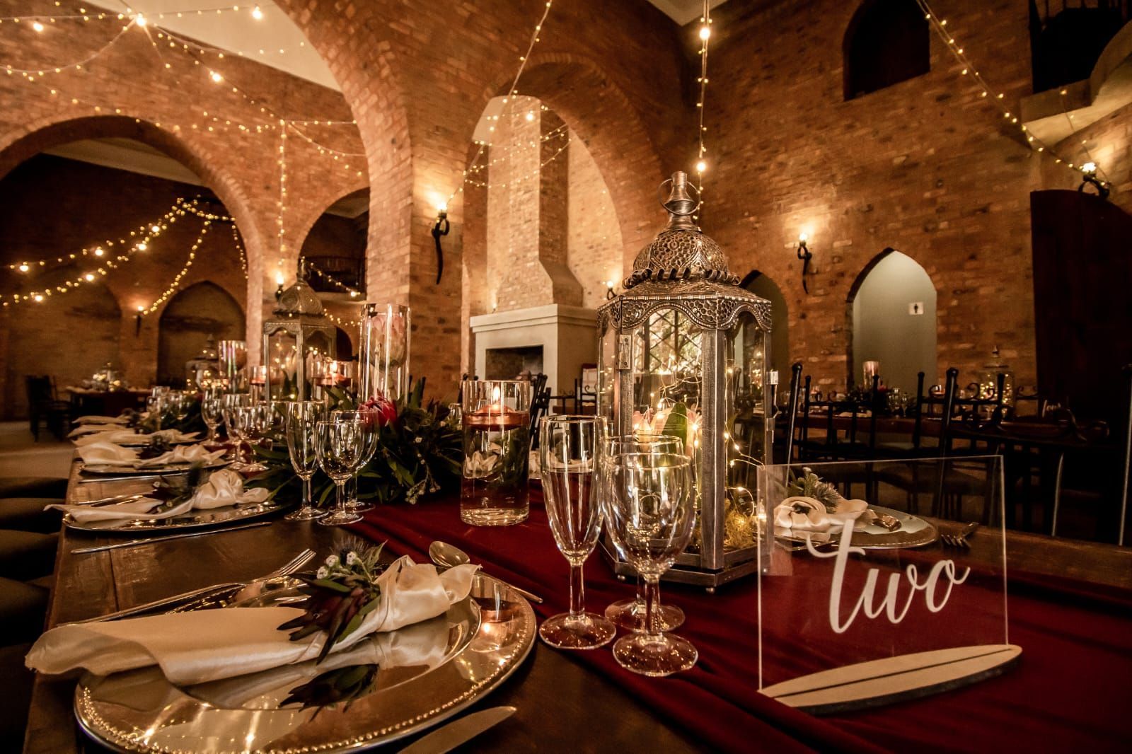 A table set for a wedding reception with table number two on it in preparation for a wedding at Riverside Castle.